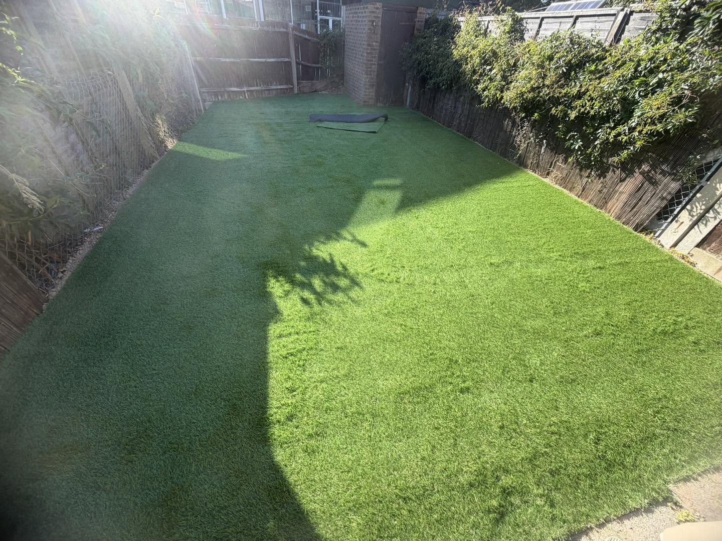 After: the same garden finished with artificial grass