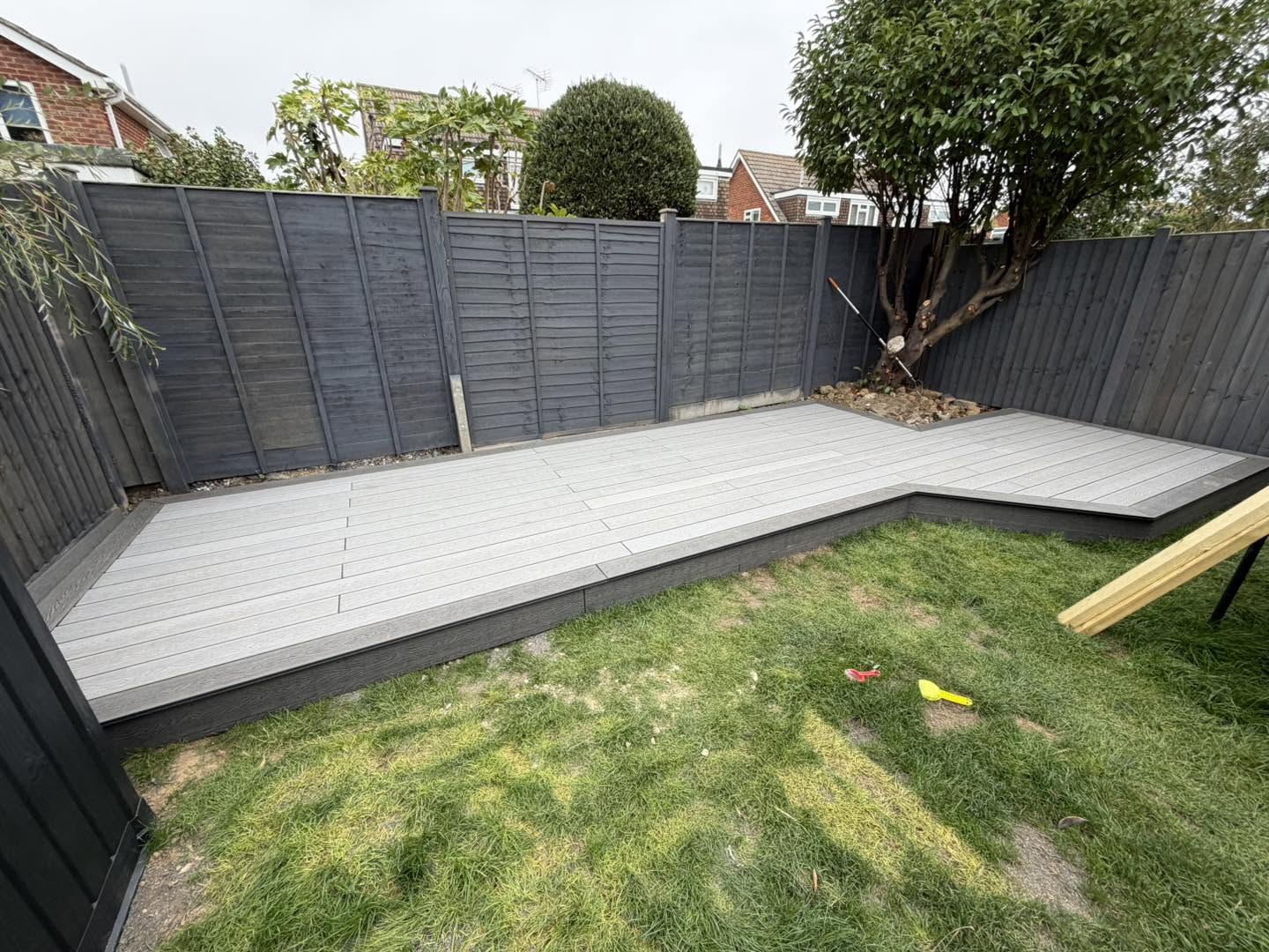 The finished decking seen across the lawn