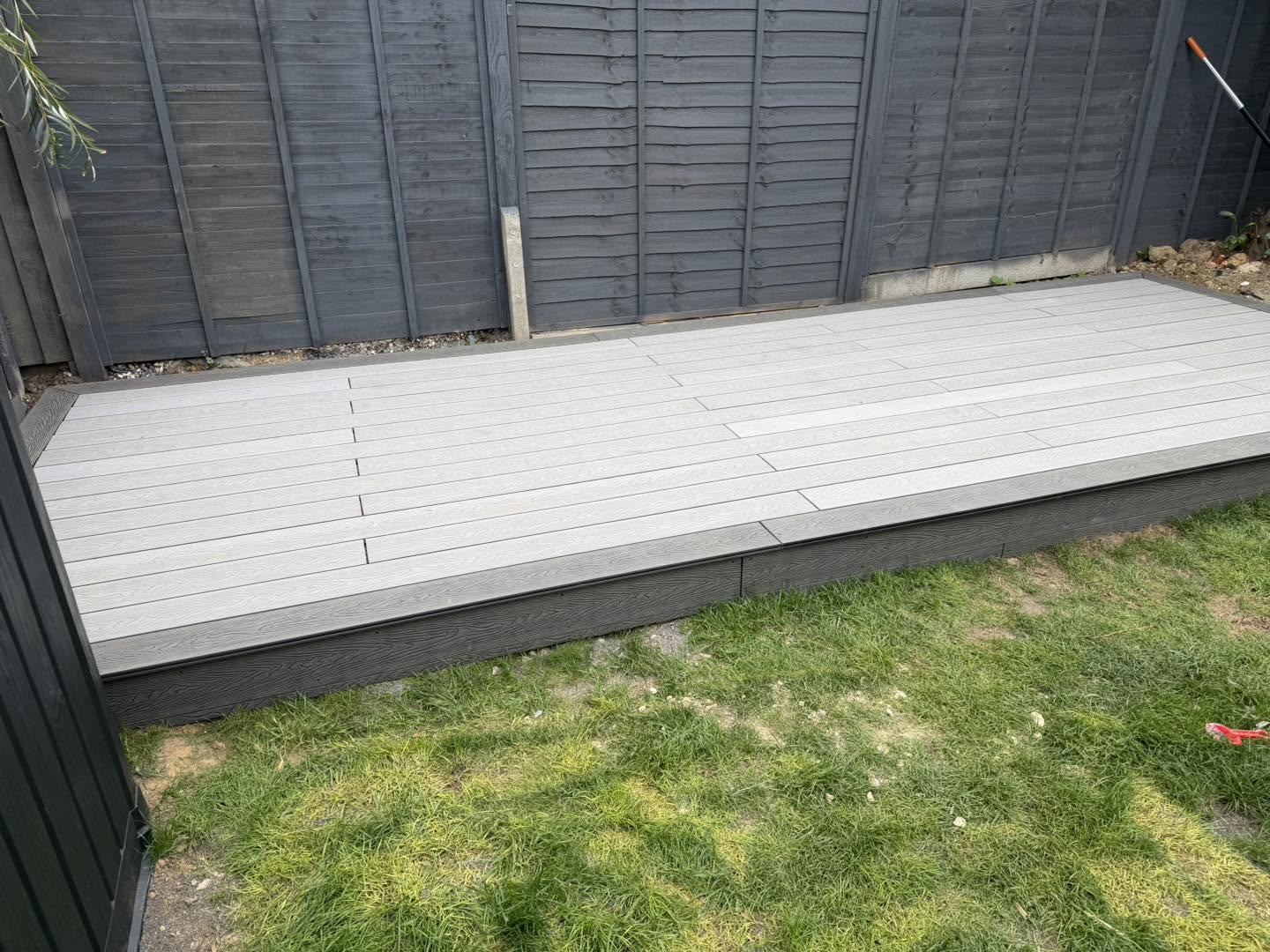 The full length of the new decking against the back fence
