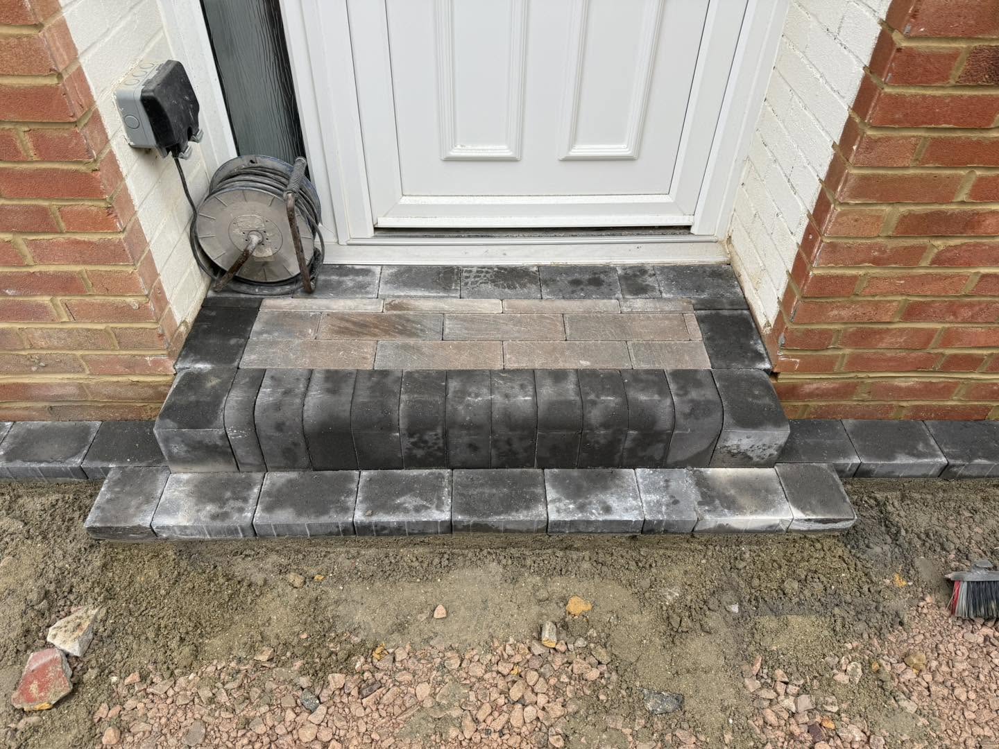 A new block-paved step at the front door