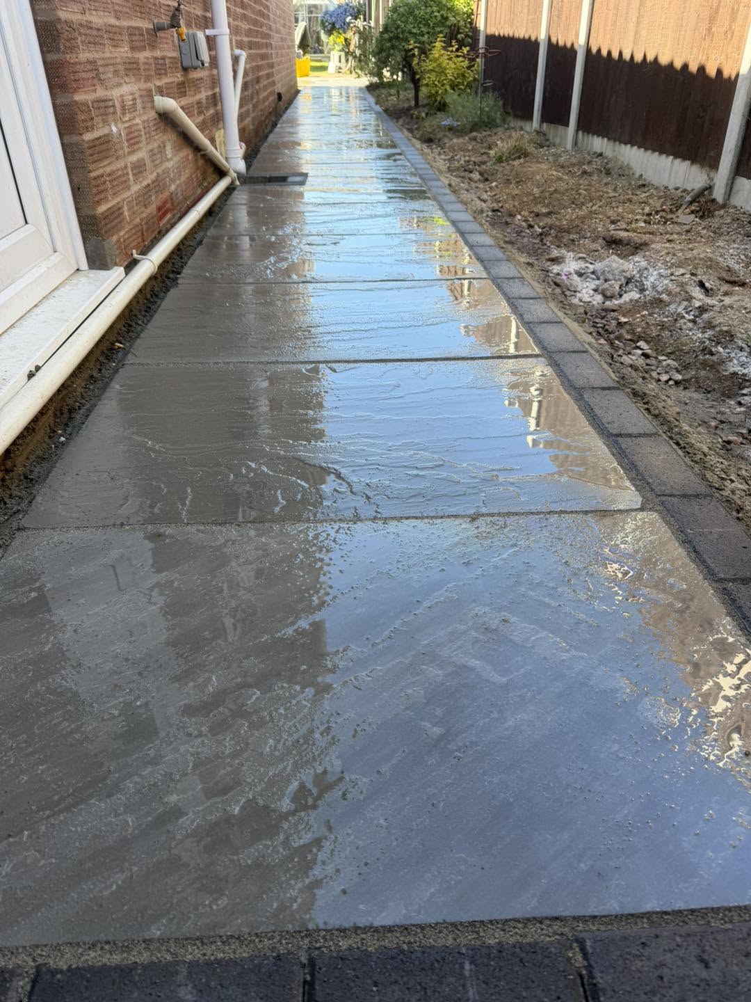 The side path running to the back garden, freshly washed