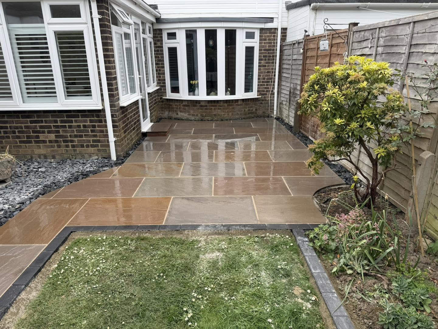 The new patio, freshly washed, outside the back windows